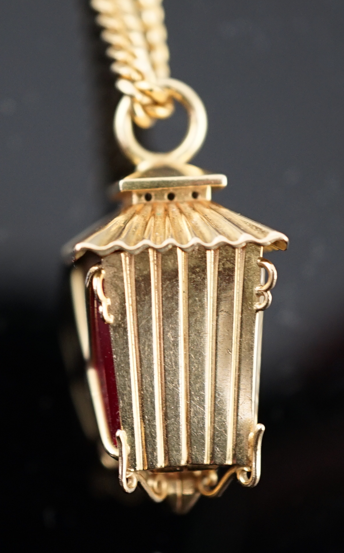 A lady's novelty gold Rolex pendant fob watch, modelled as a lantern, with baton numerals, together with an 18ct gold chain